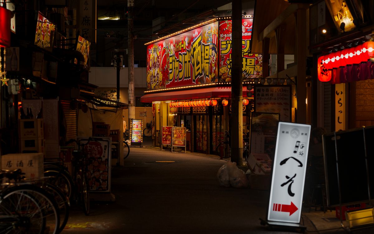 Grilled skewers and cold beer at a traditional Japanese izakaya