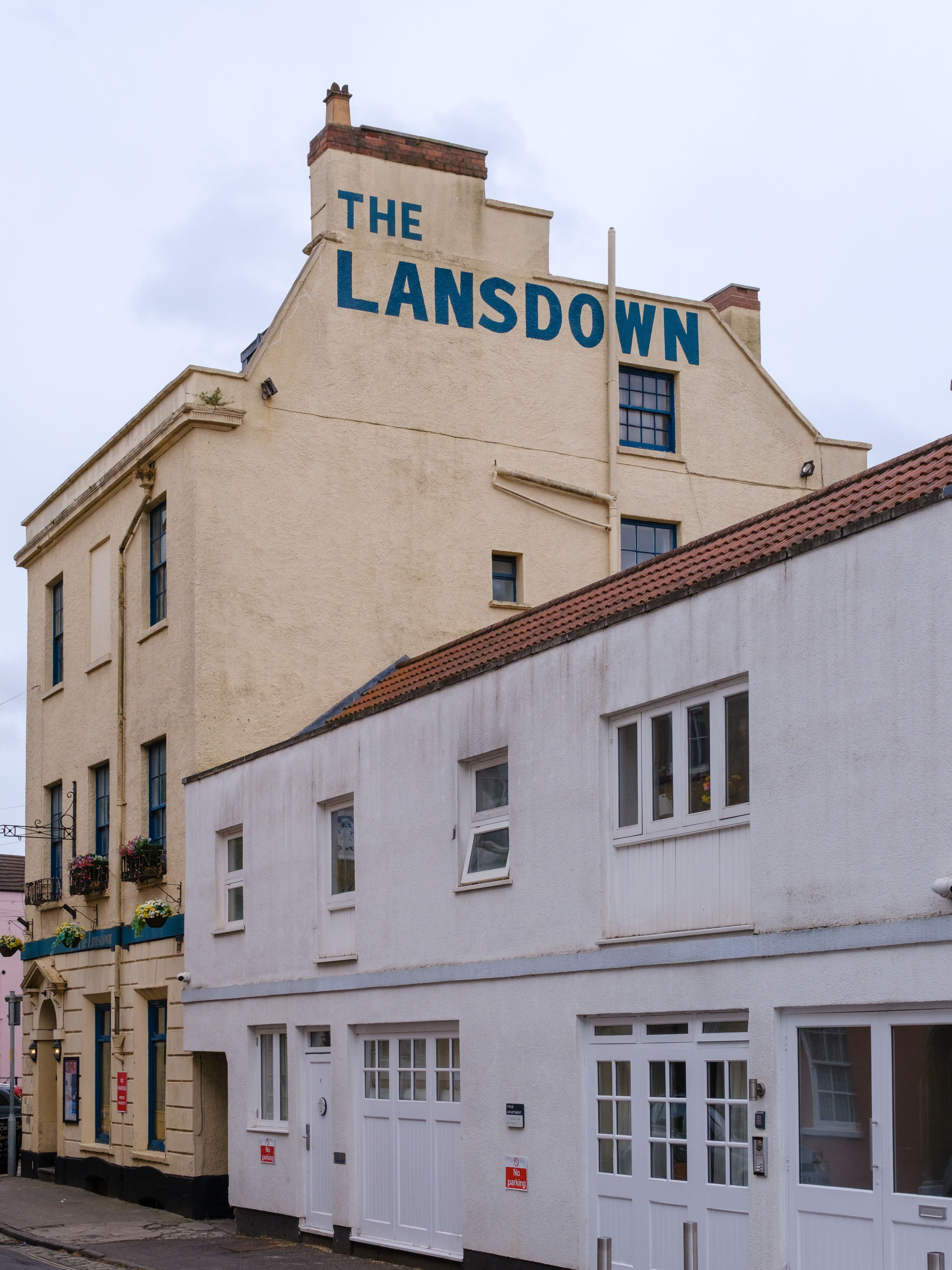 A view of The Lansdown building with classic architecture in an urban street.