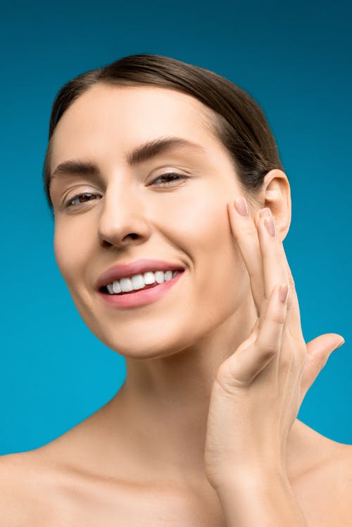 Free Woman Touching Her Face Stock Photo