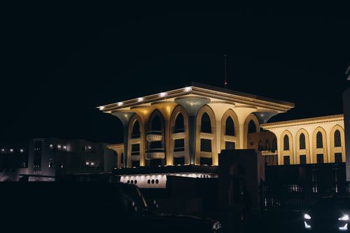 Free A striking nighttime view of the illuminated Al Alam Palace, showcasing Omani architecture in Muscat. Stock Photo