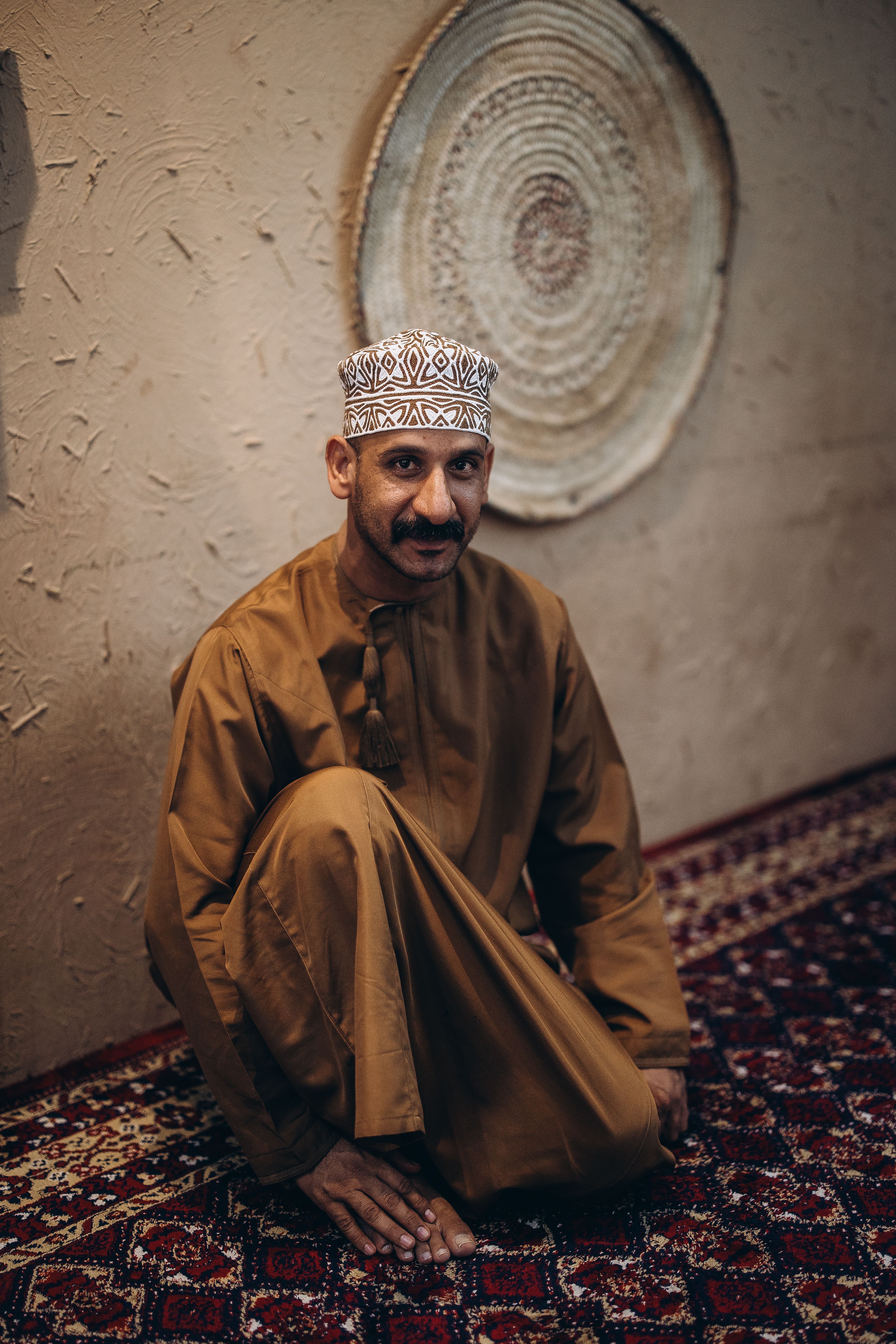 Traditional Omani Attire in Muscat Setting · Free Stock Photo