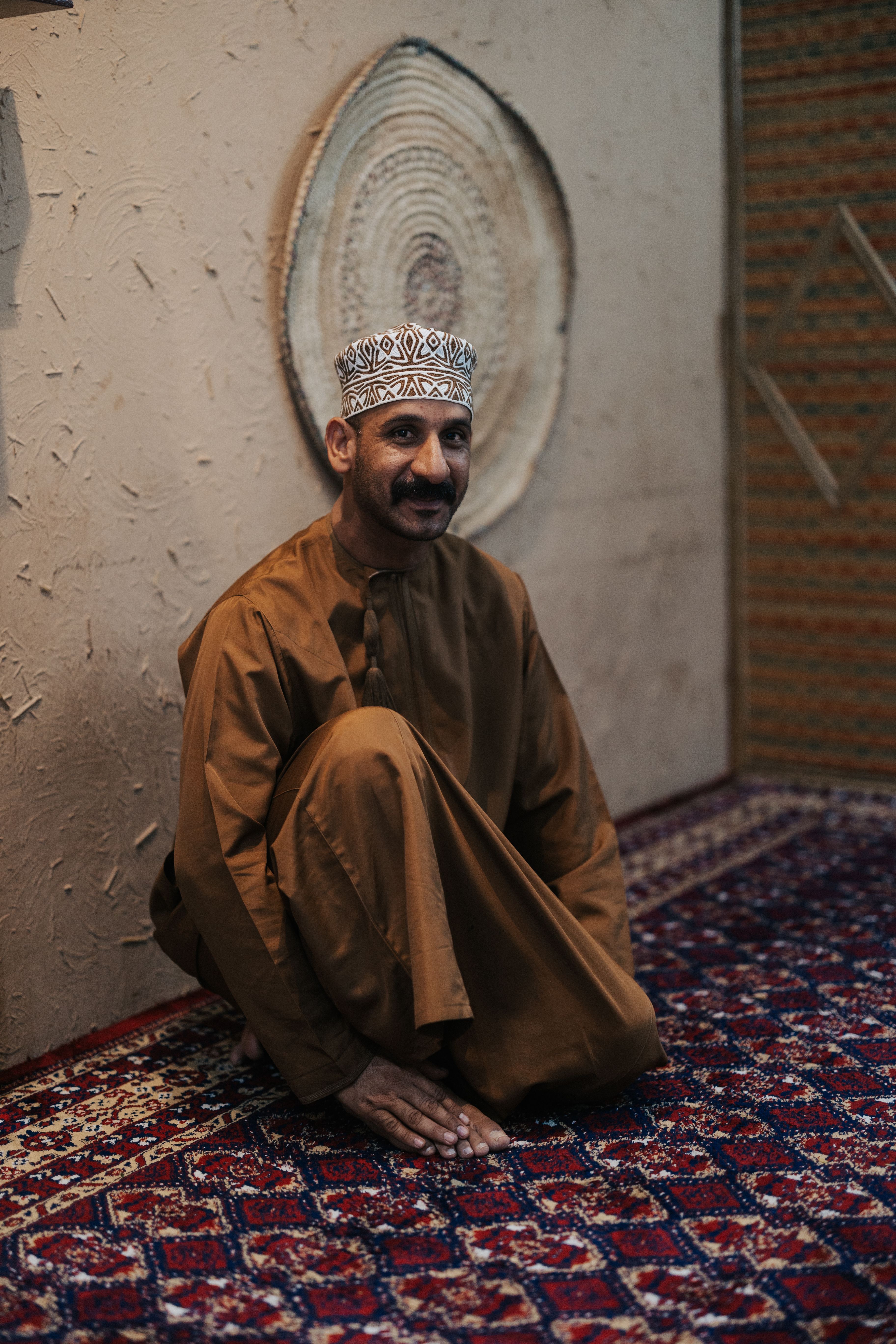 Traditional Omani Attire in Muscat Setting · Free Stock Photo