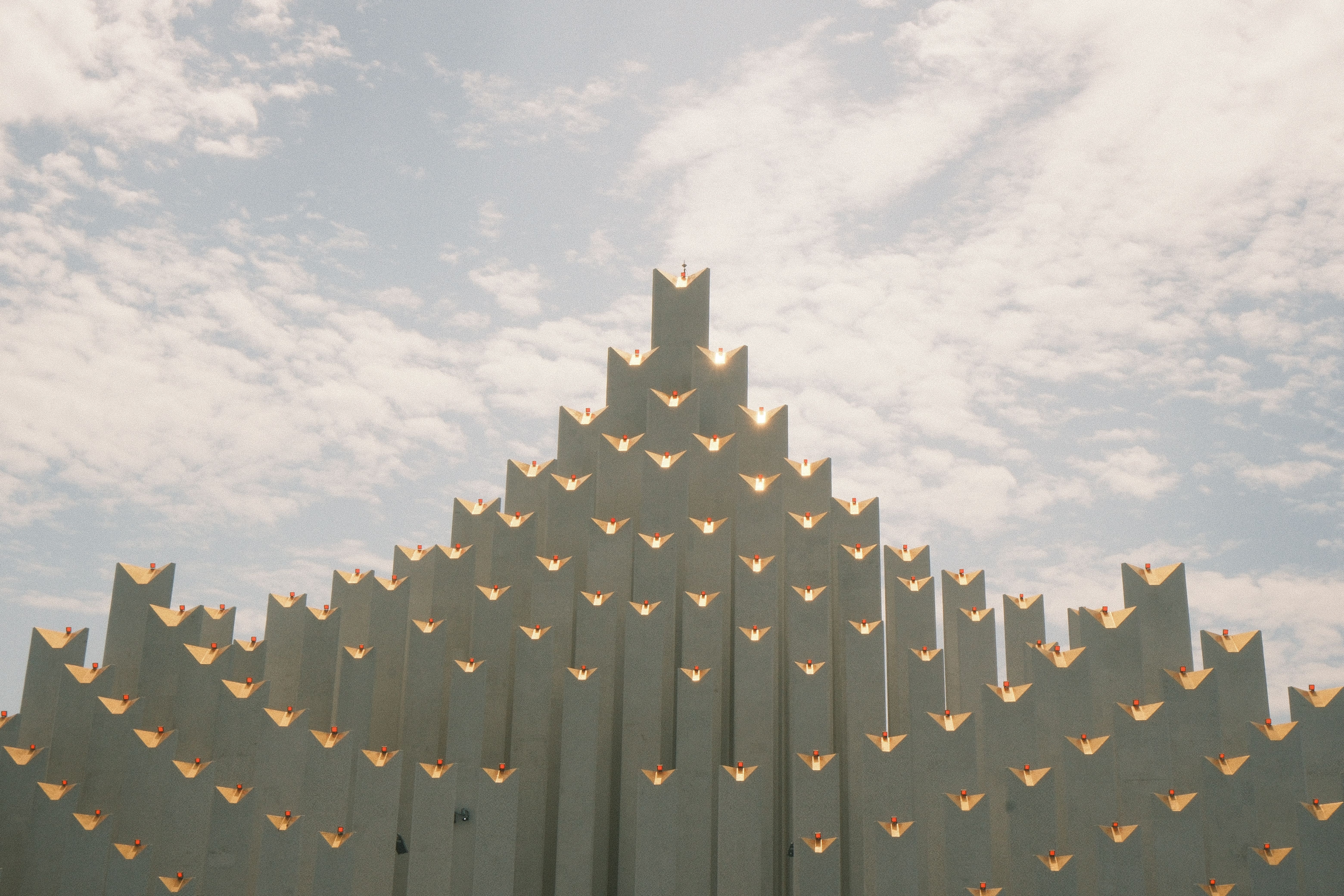 Unique architectural design captured against a bright sky in Ho Chi Minh City, Vietnam.