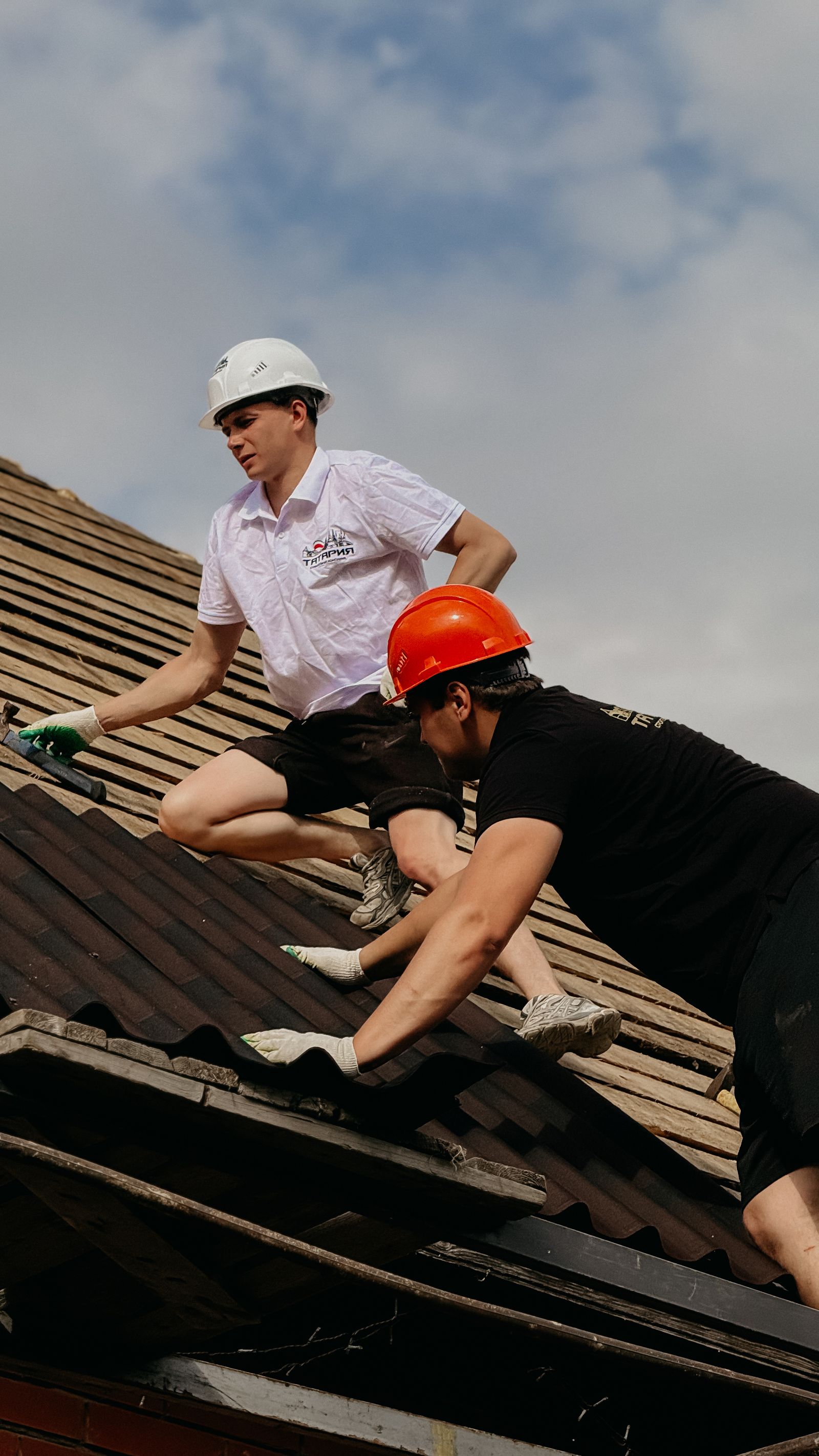 Roofing contractor inspecting a roof