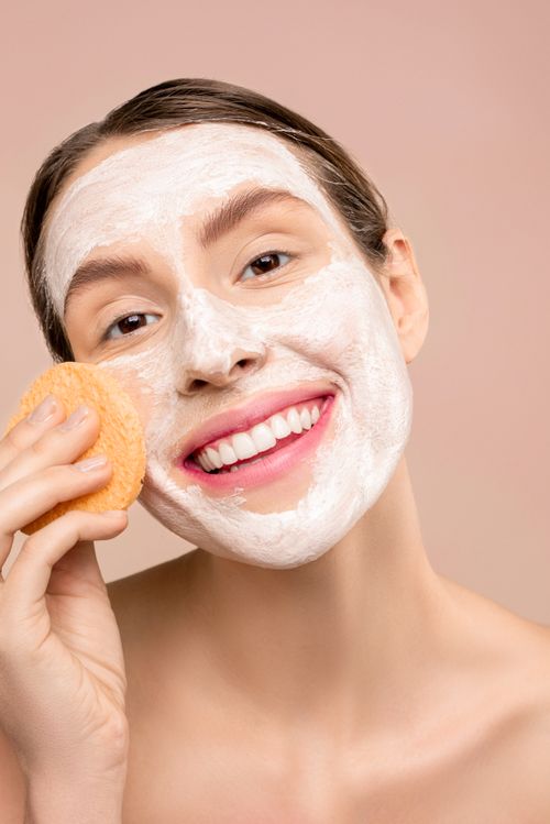 Smiling client with a foaming cleanser