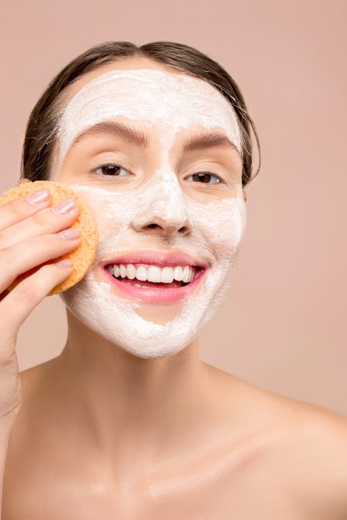 Woman With White Facial Wash on Face