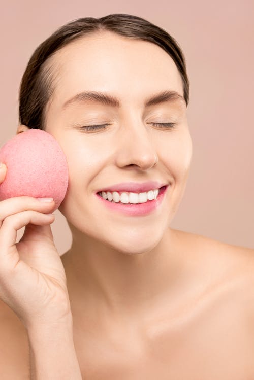 Woman Holding Pink Sponge