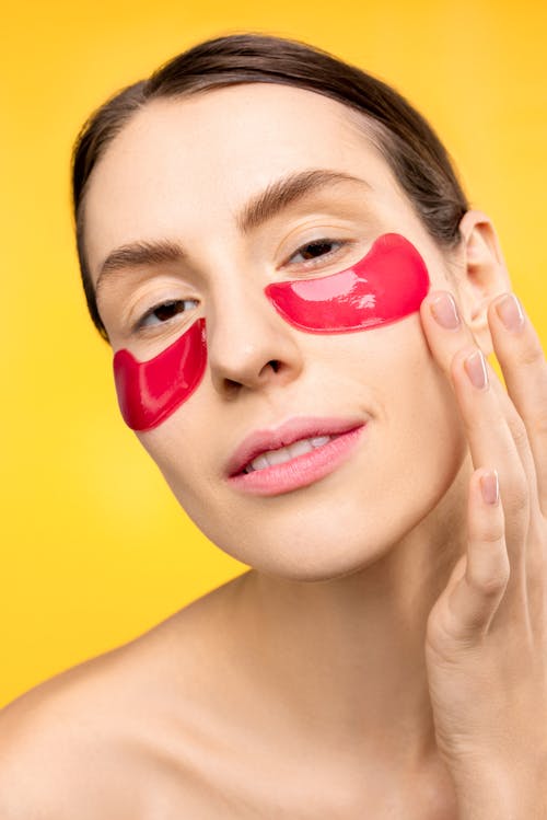 Free Woman With Red Under Eye Mask Stock Photo