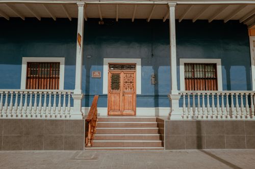 Free Charming colonial facade with wooden door in Pacasmayo, Peru. Stock Photo