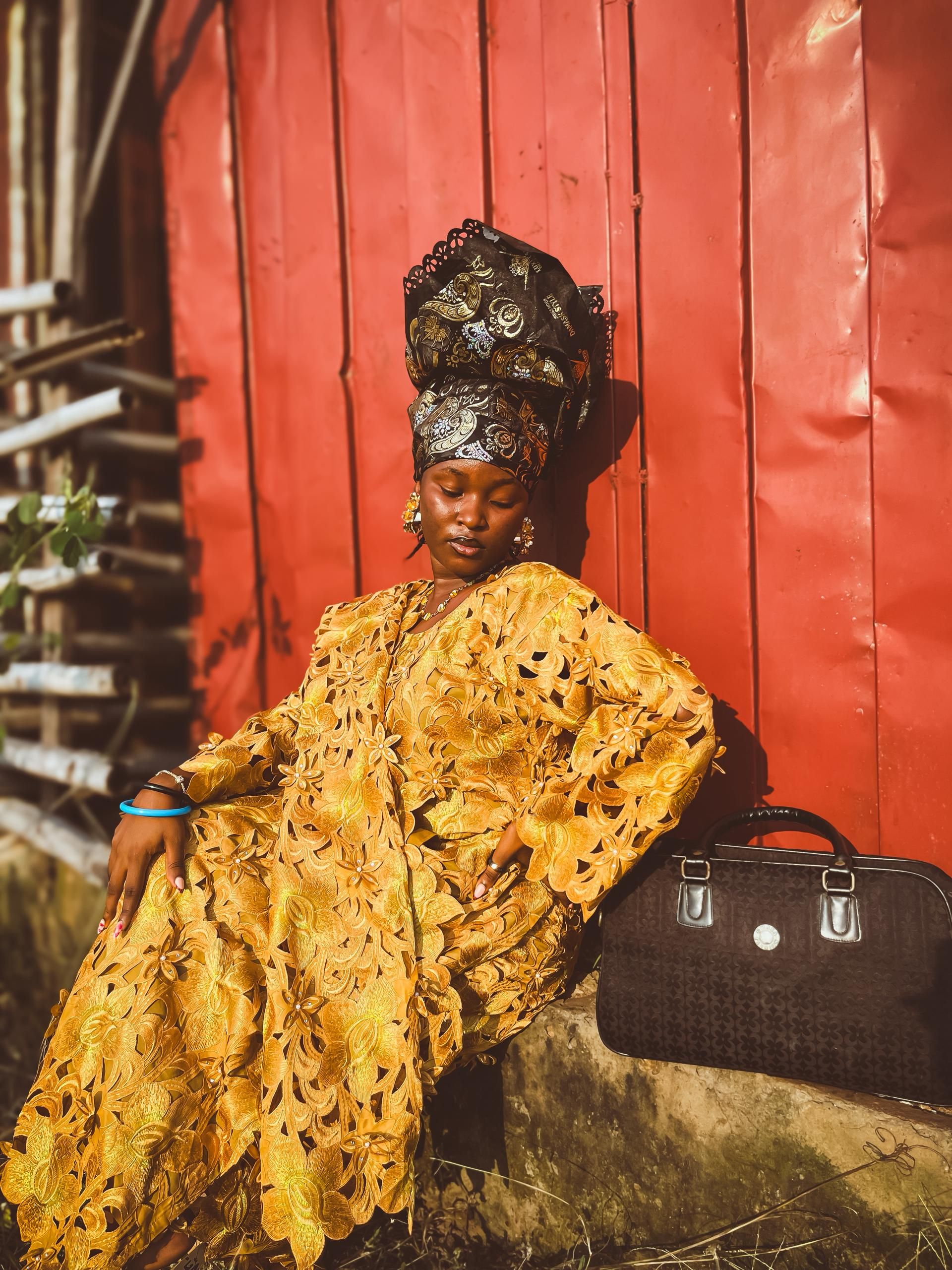 Elegant African Woman in Traditional Yellow Attire · Free Stock Photo