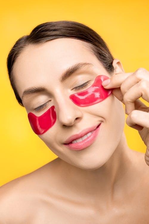 Woman With Red Under Eye Mask