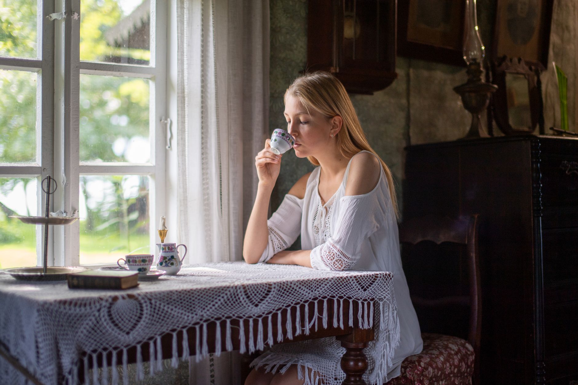 Historic tea room with lace tablecloths and Victorian details in downtown Springfield