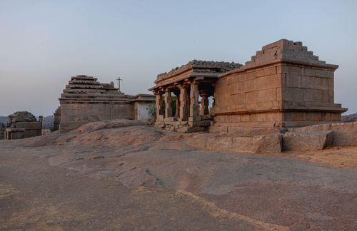 Free Historic stone temple at Hampi, Karnataka, India, during sunset. Scenic heritage architecture and tranquil atmosphere. Stock Photo