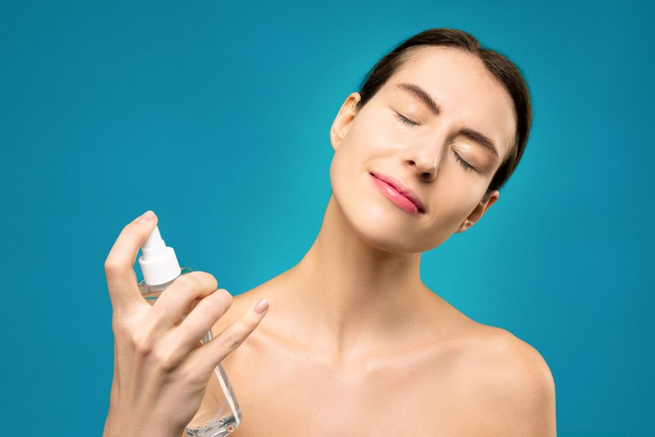 Woman holding a skincare spray bottle — GentleSen HOCl tablets let you make fresh hypochlorous acid at home