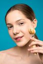 Woman Using Facial Roller