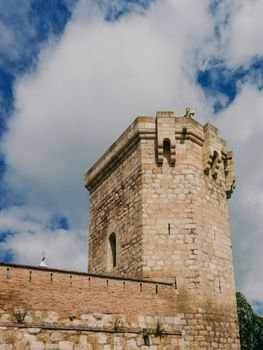 A charming stone tower under a vibrant blue sky in Daroca, Spain, showcasing medieval architecture.
