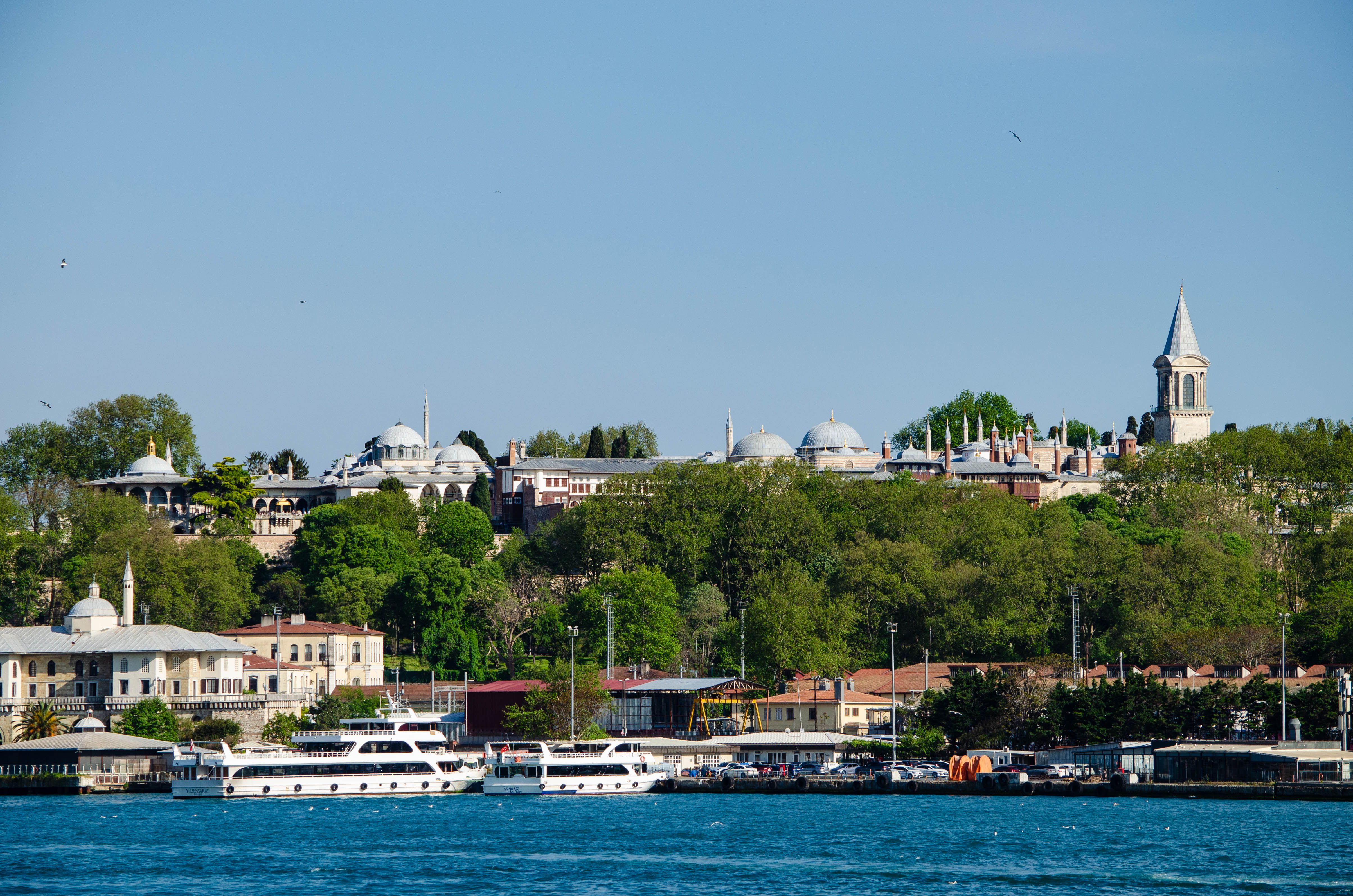 Scenic view of Topkapi Palace and Bosphorus Strait in Istanbul, showcasing historical architecture and marine traffic.
