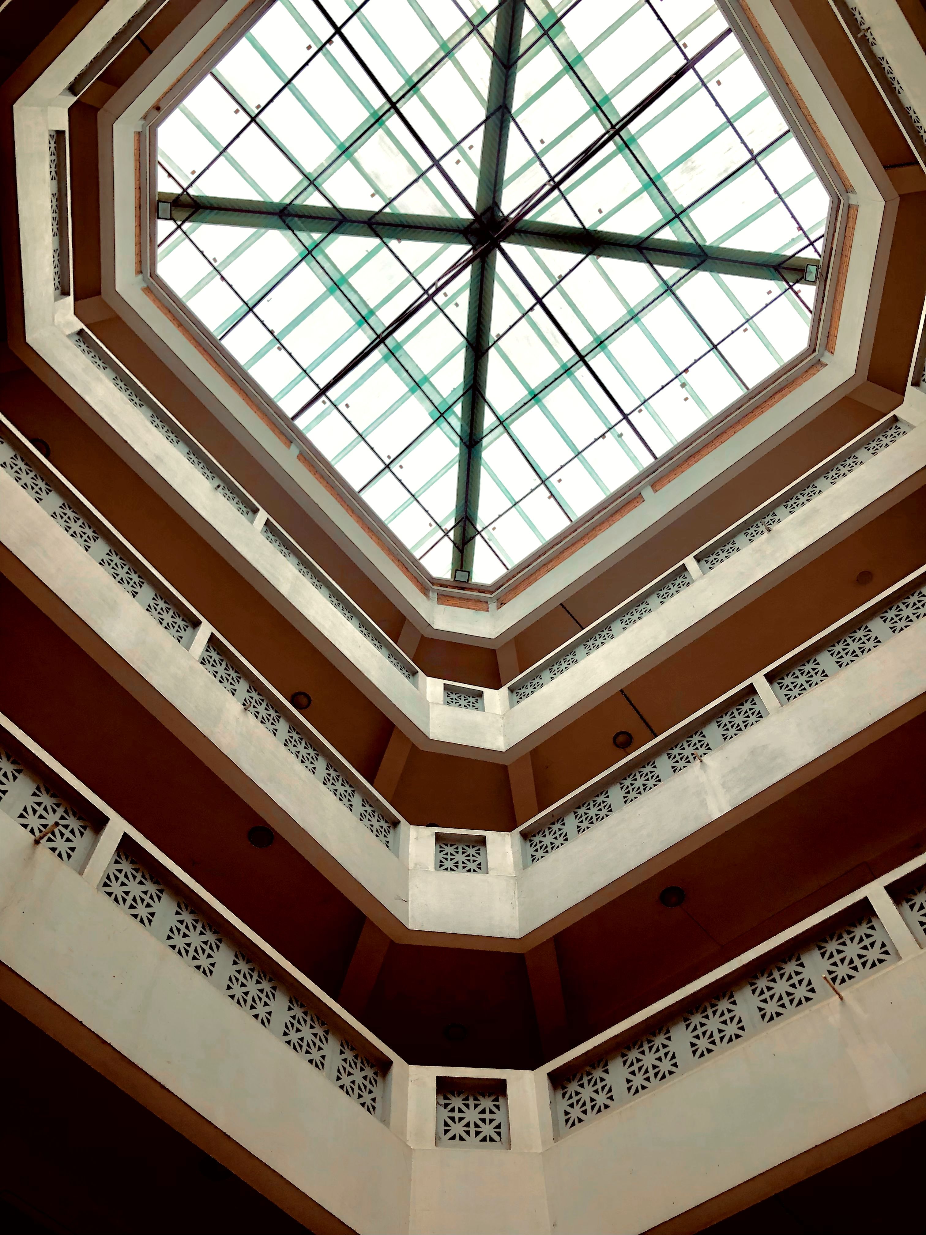 Captivating view of an octagonal atrium ceiling with intricate geometric designs.