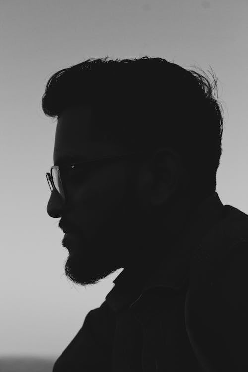 Grayscale Side View Photo of Man in Glasses