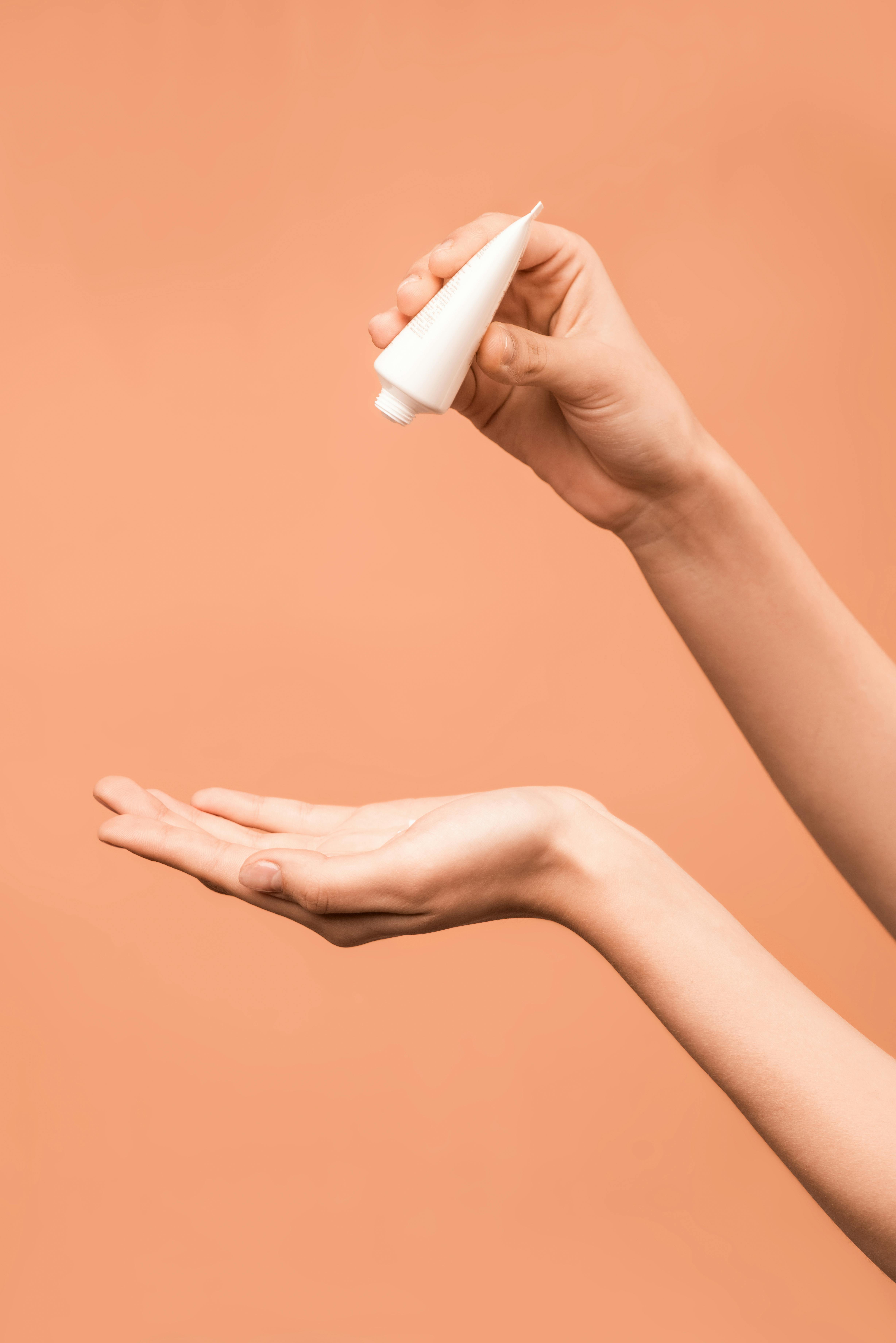 Person Holding White Plastic Tube · Free Stock Photo