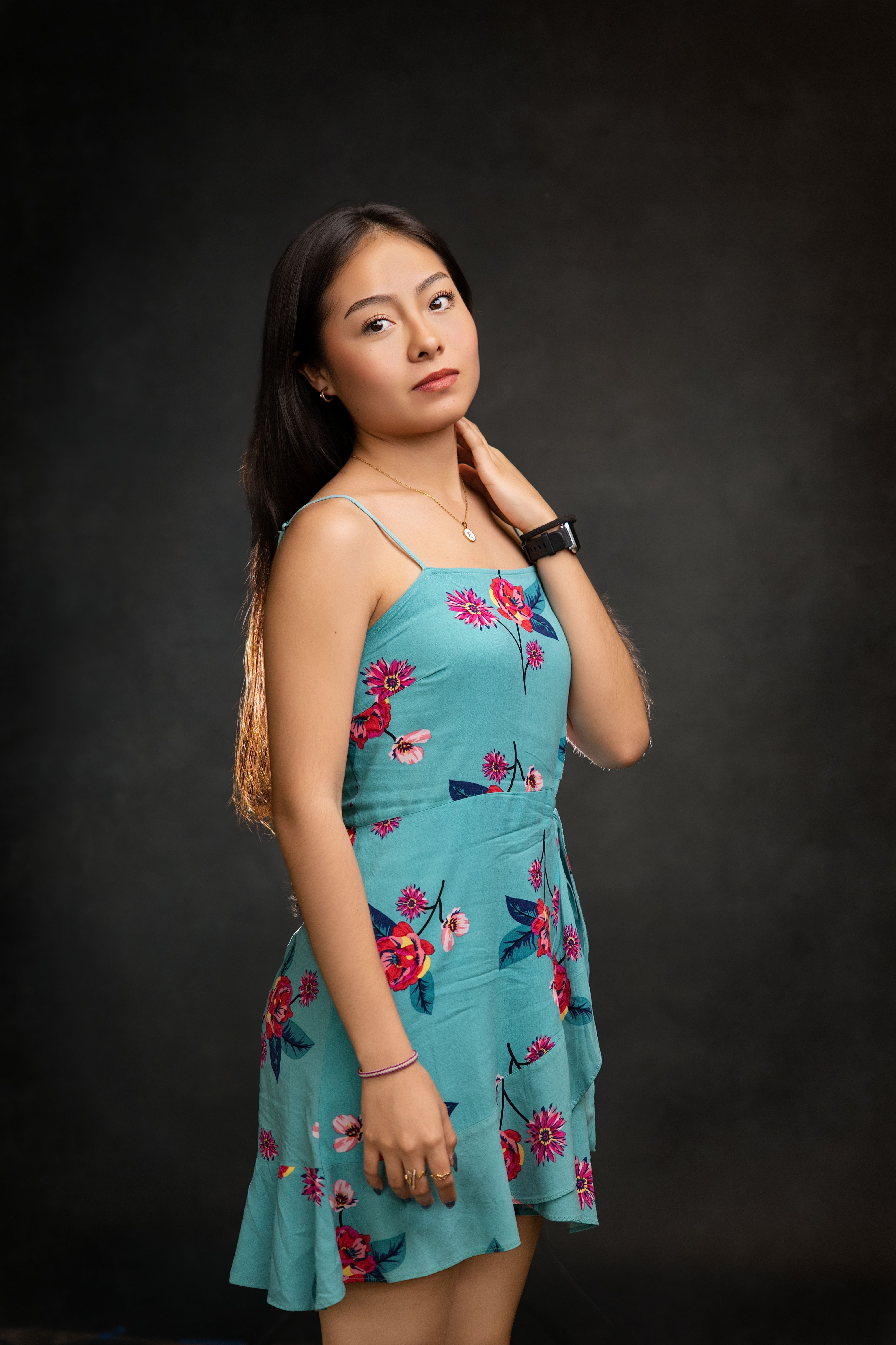 Elegant Portrait of a Young Woman in Floral Dress · Free Stock Photo