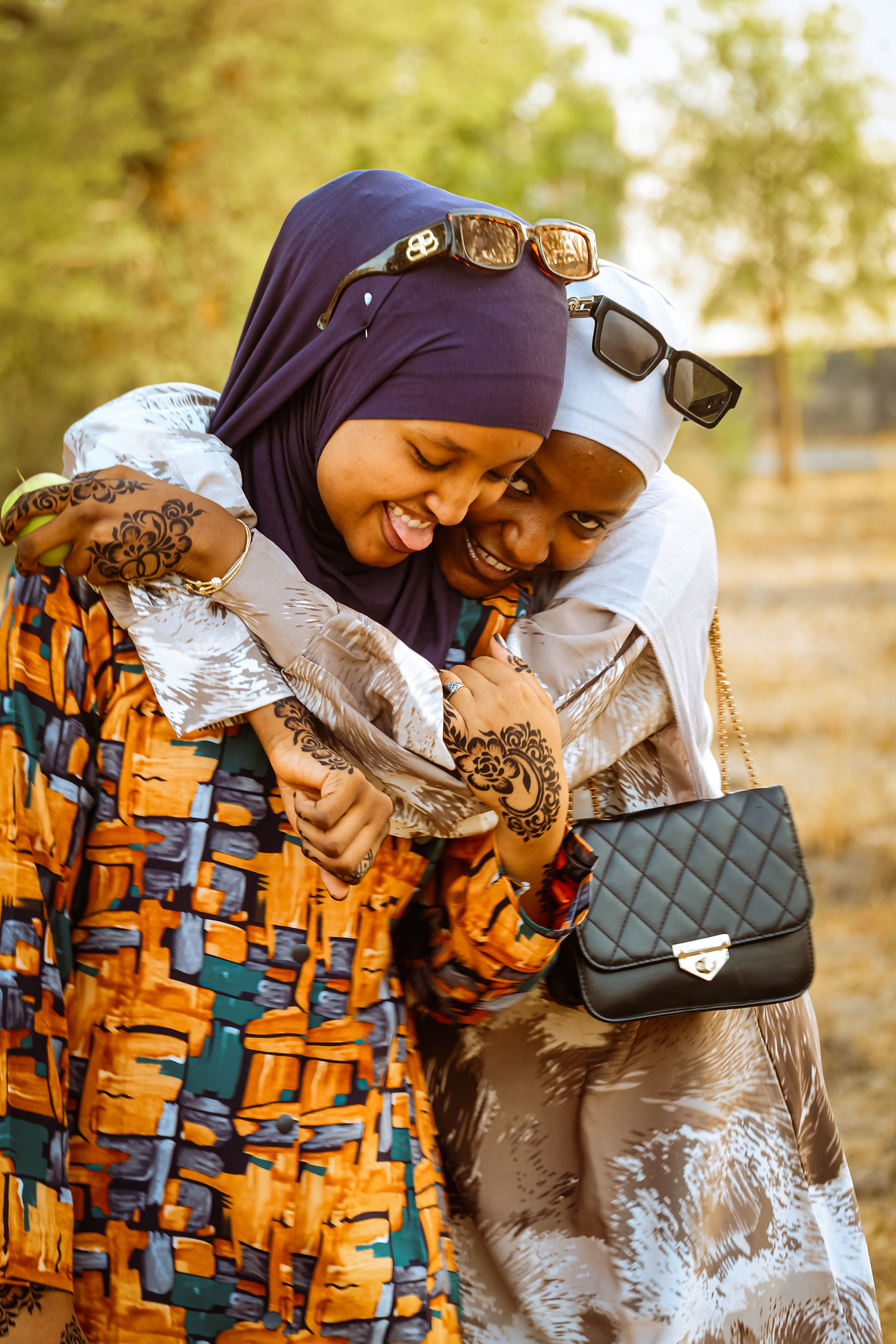 Joyful Friendship Hug Outdoors in Spring · Free Stock Photo