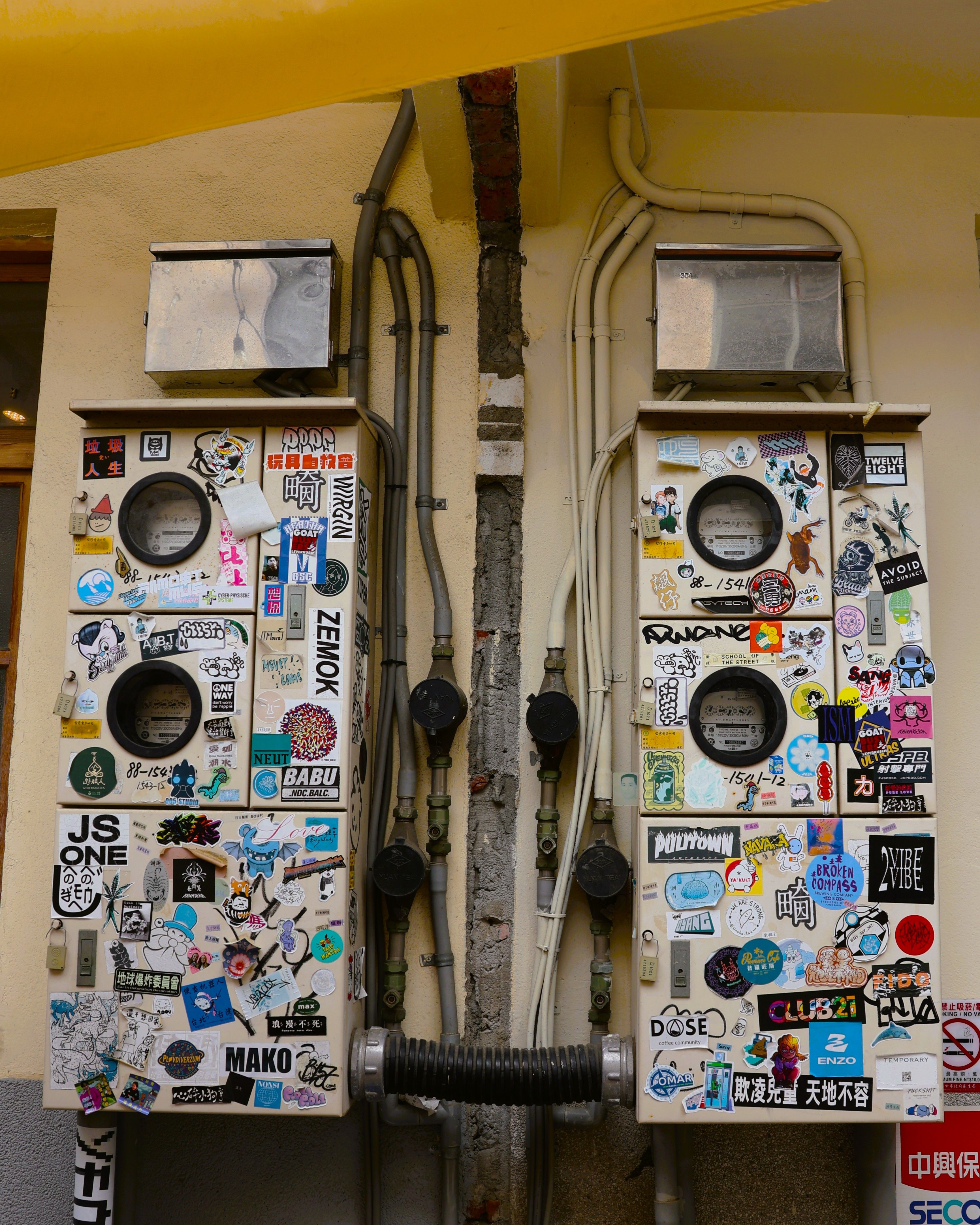 Colorful Sticker-Covered Utility Boxes in Taiwan · Free Stock Photo