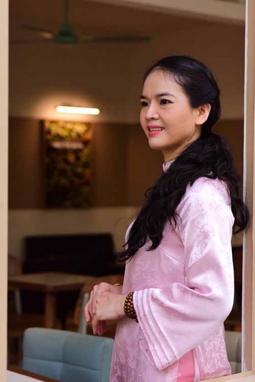 Woman in Pink Traditional Dress Indoors · Free Stock Photo