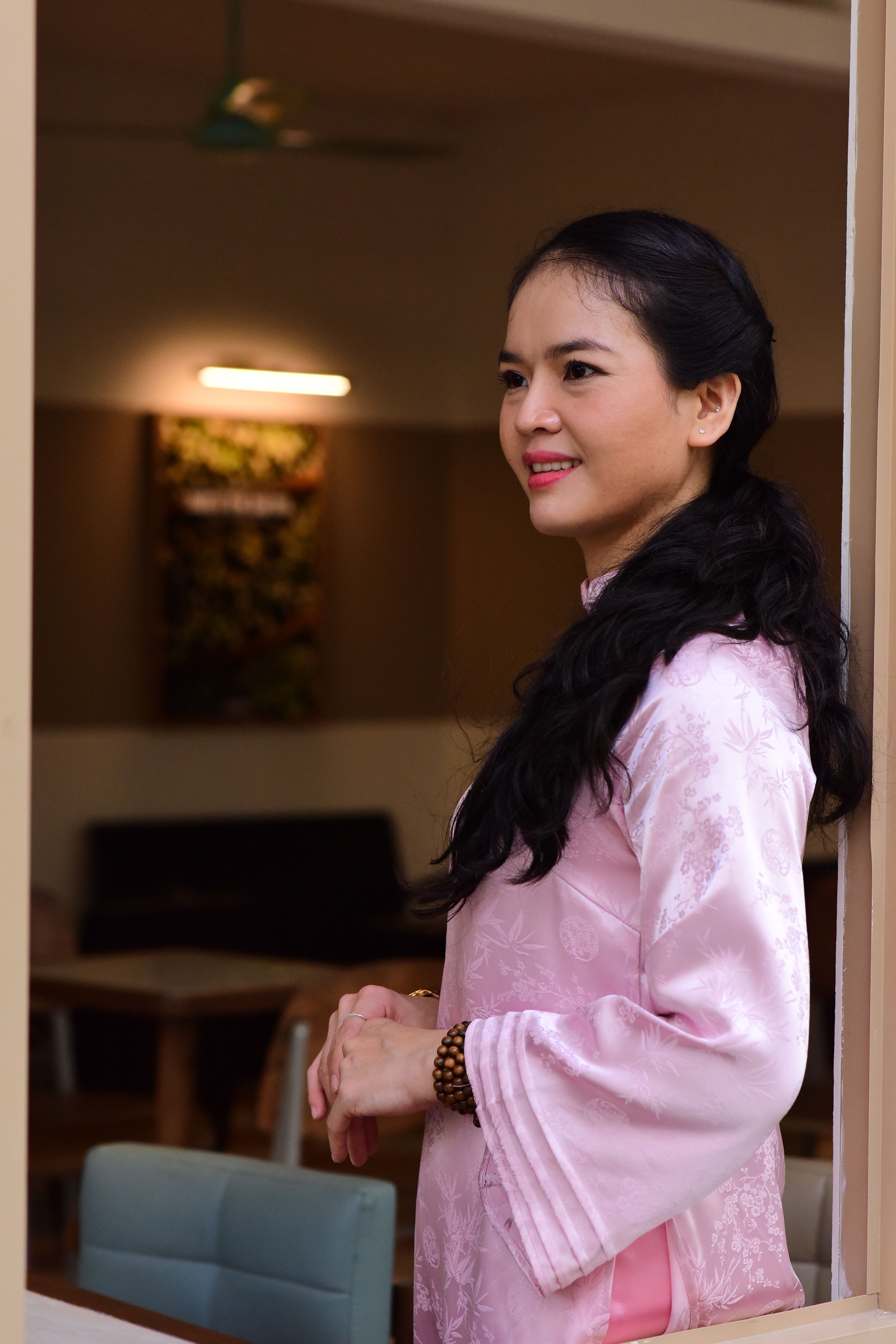 Portrait of a Woman in Traditional Pink Attire Indoors · Free Stock Photo