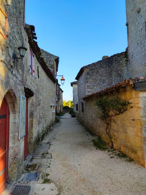 Free Explore the quaint medieval architecture of Larressingle's ancient cobbled street in Occitanie, France. Stock Photo