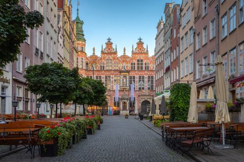 Free Explore the picturesque architecture and charm of Gdańsk's historic streets, featuring colorful facades and vibrant atmosphere. Stock Photo