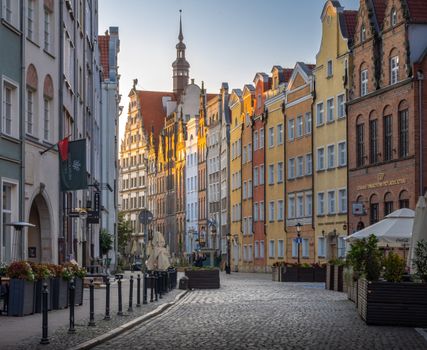 Beautiful Gdańsk street view with historic architecture at sunset, Pomeranian Voivodeship, Poland.
