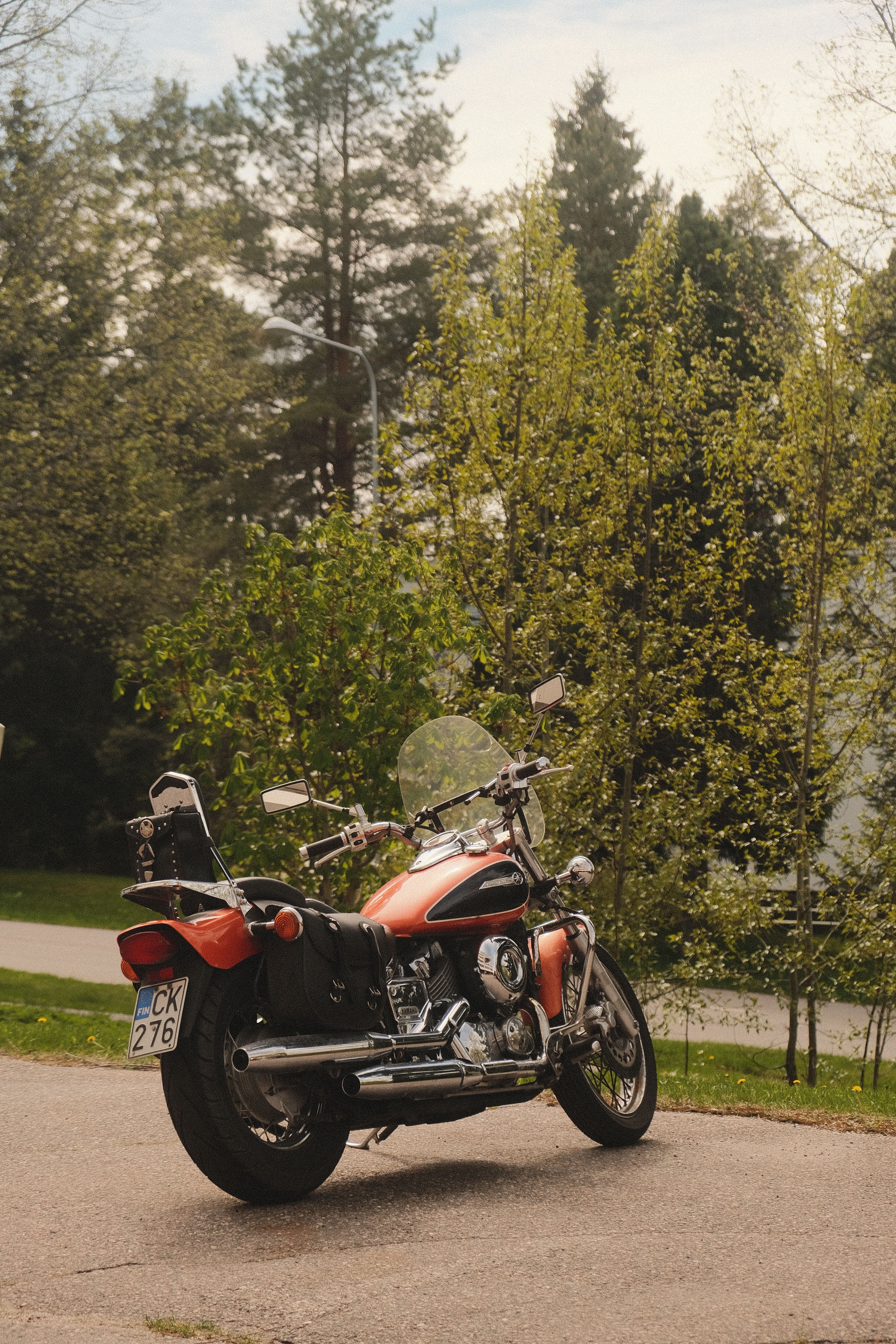 Red Motorcycle Parked in Spring Forest · Free Stock Photo