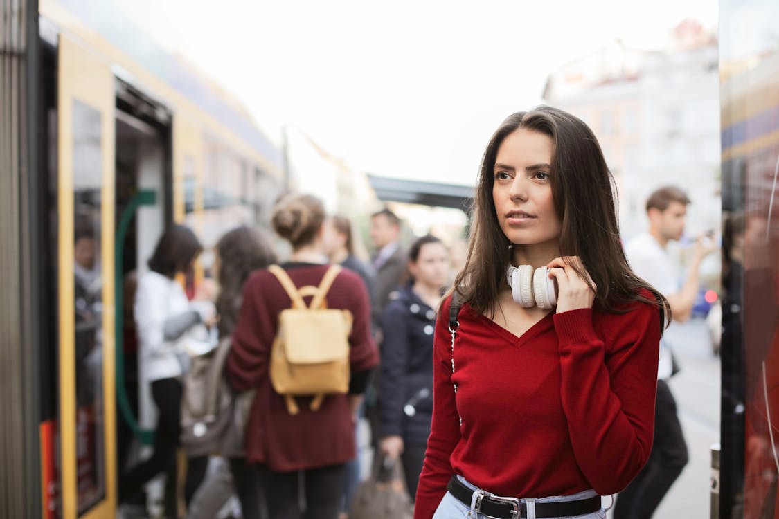 Young woman standing on train platform