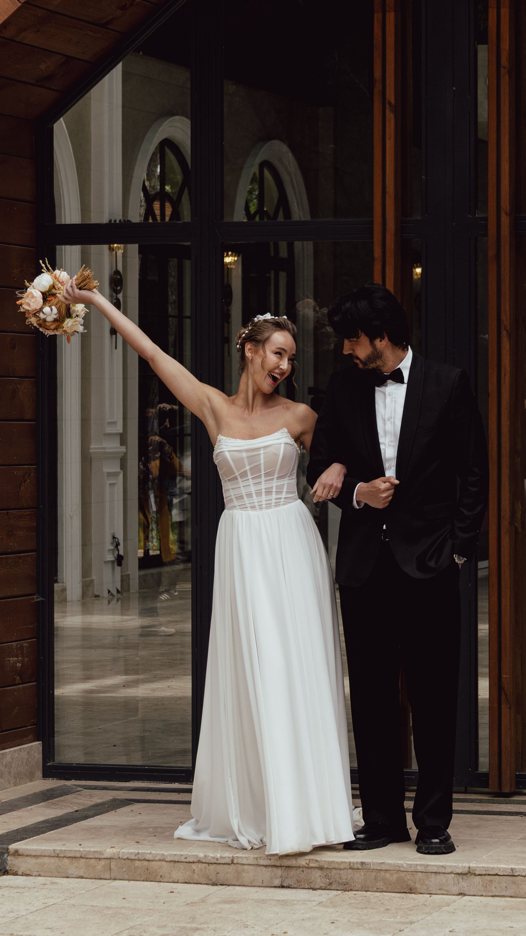 Bride and groom celebrating their wedding day in İstanbul, expressing joy and elegance.