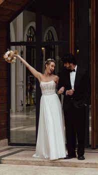 Bride and groom celebrating their wedding day in İstanbul, expressing joy and elegance.