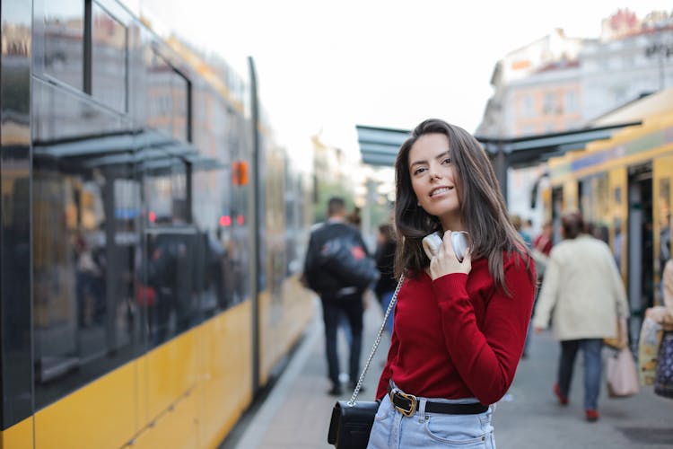 Trendy Woman Standing On Train Platform