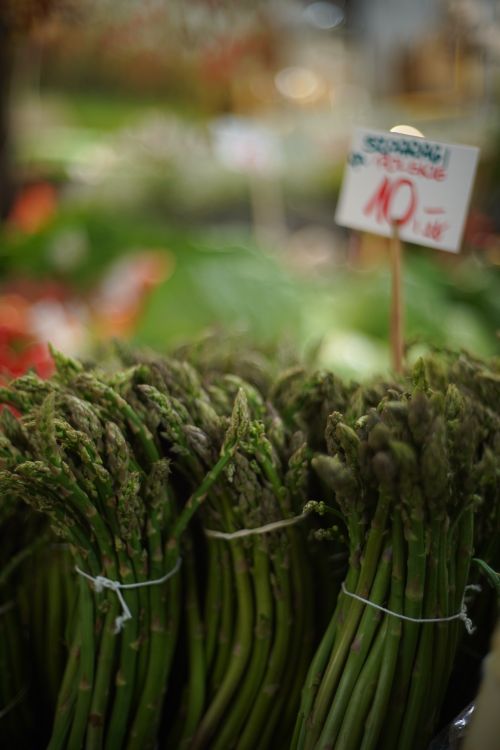 Free Bundles of green asparagus on display at a market in Wrocław, Poland. Stock Photo