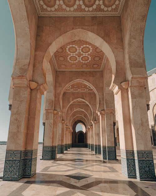 Free Stunning archways and intricate designs of Hassan II Mosque in Casablanca, Morocco. Stock Photo