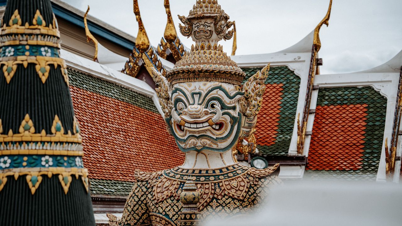 close up of a traditional thai yaksha statue at wat phra kaew in bangk