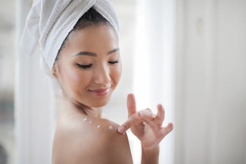 Topless Woman Putting Hydratant