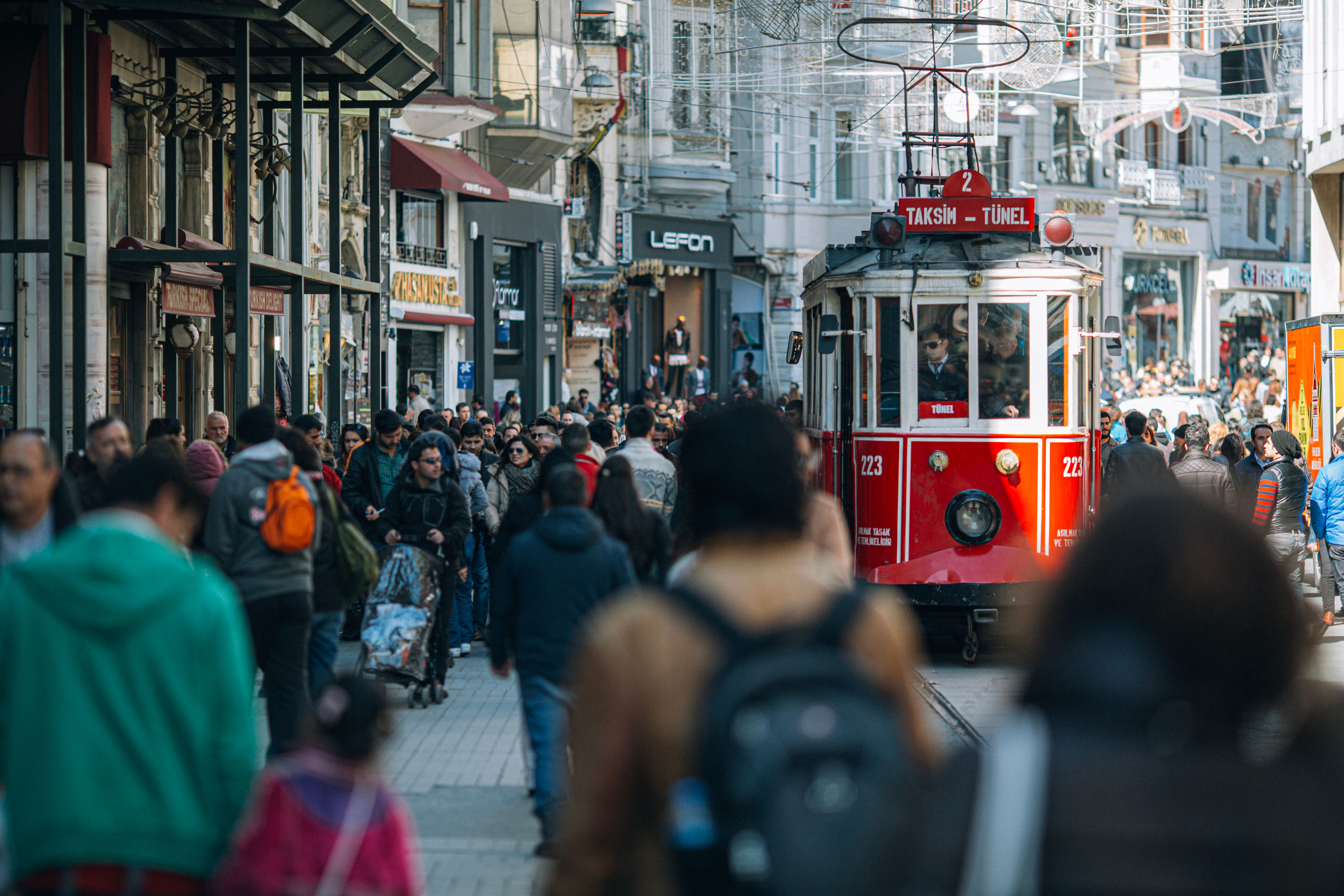 Person holding an Istanbulkart at a public transport turnstile in Istanbul, Turkey