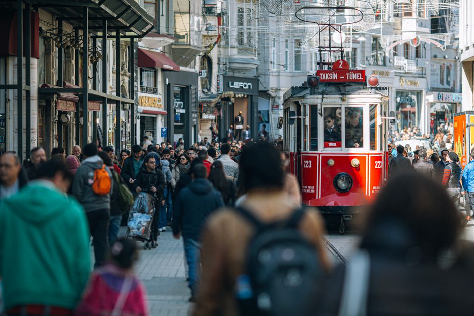 Person holding an Istanbulkart at a public transport turnstile in Istanbul, Turkey
