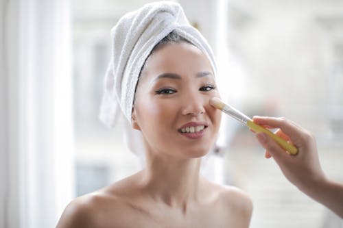Make-up Artist Applying Make-up to a Woman