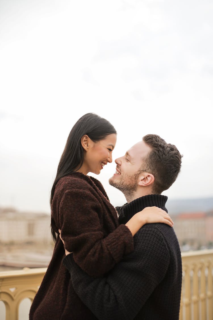 Selective Focus Photo Of Man Lifting Up His Woman