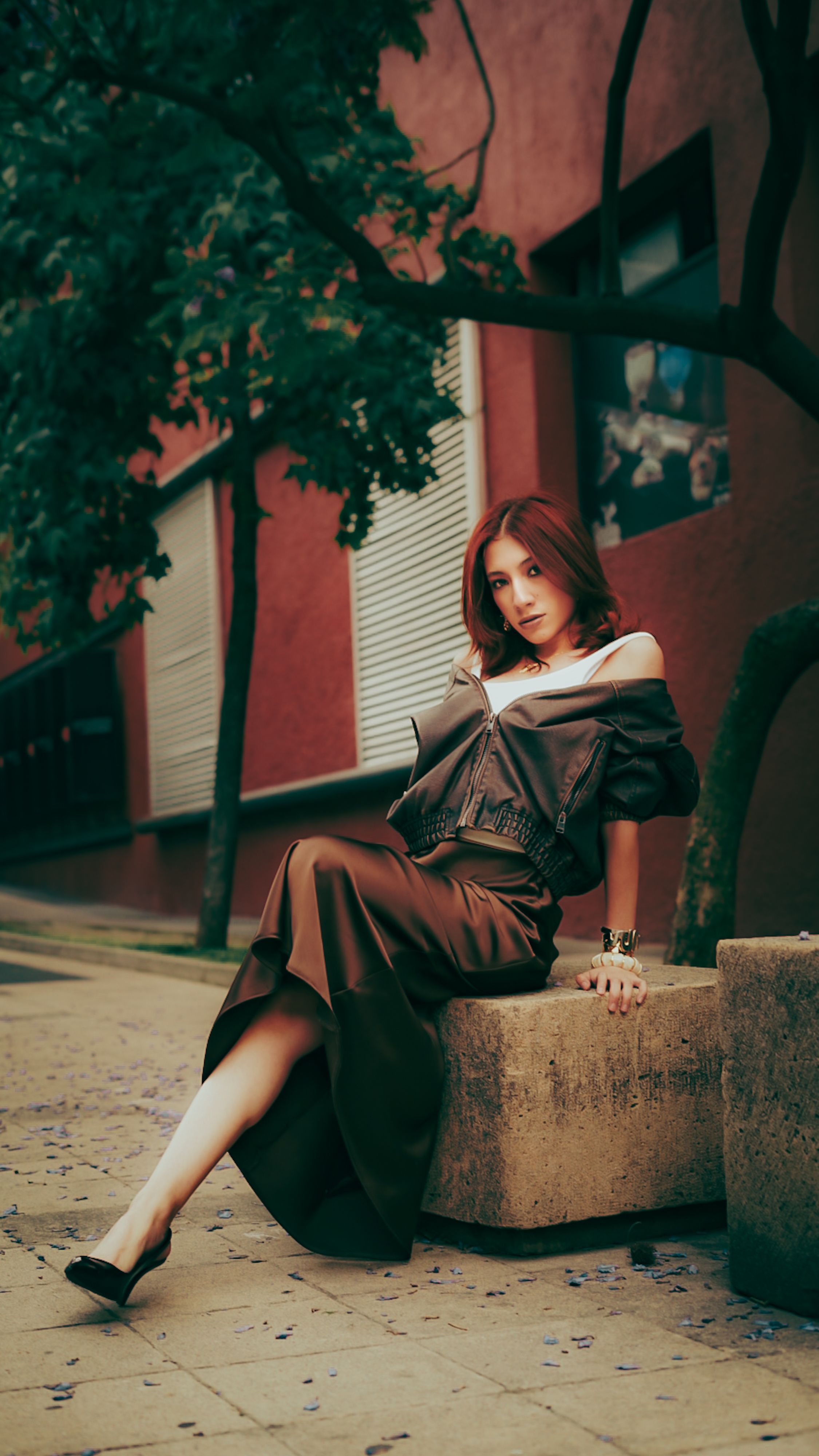 Stylish Woman Posing Outdoors in Urban Setting · Free Stock Photo