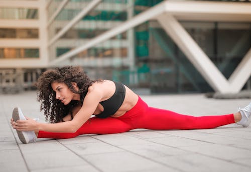 Free Woman Stretching Before Workout Stock Photo
