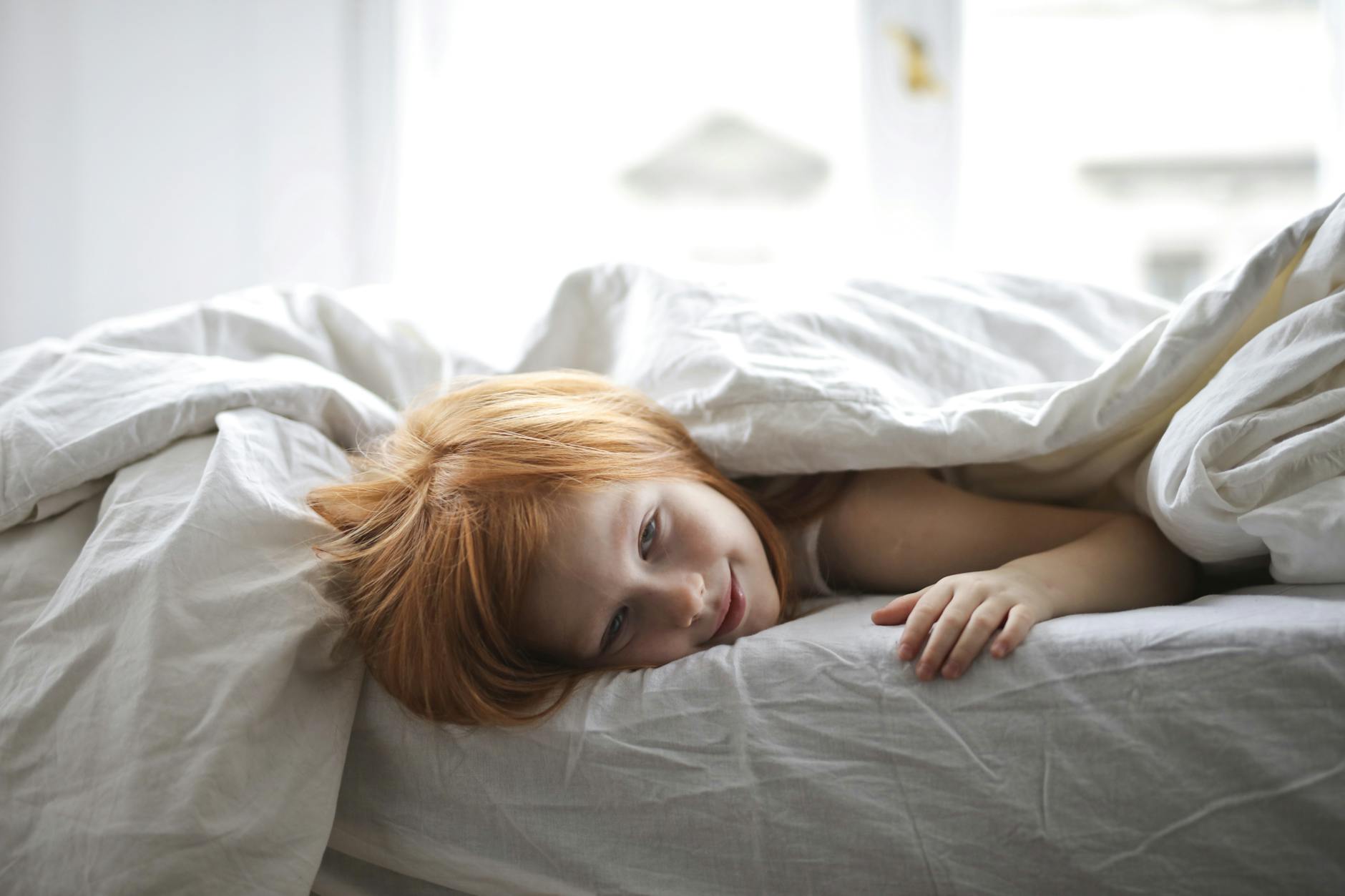 Child laying in bed