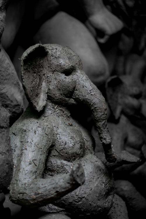Free Clay sculpture of Ganesha being crafted in Kumartuli, Kolkata, showcasing artistic heritage. Stock Photo