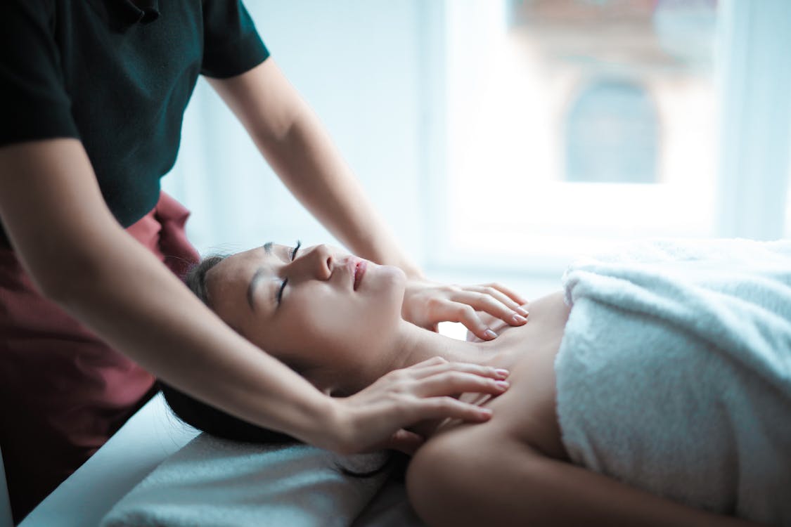Free Selective Focus Photo of Woman Getting a Massage Stock Photo